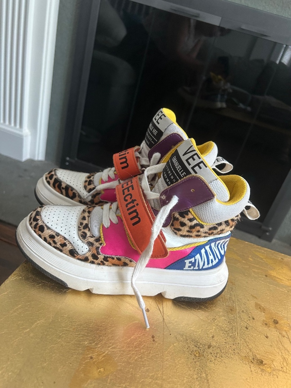 Emanuelle Vee leopard print high top sneakers with white accents and pink/blue